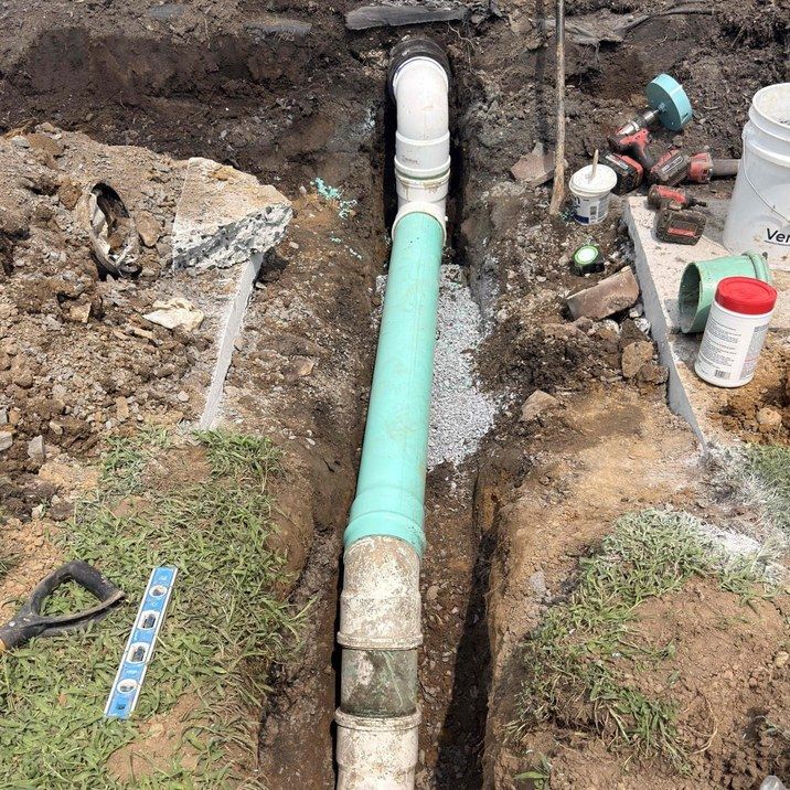 Open trench with a new sewer line laid by Leaps and Bounds in Lemoyne, PA