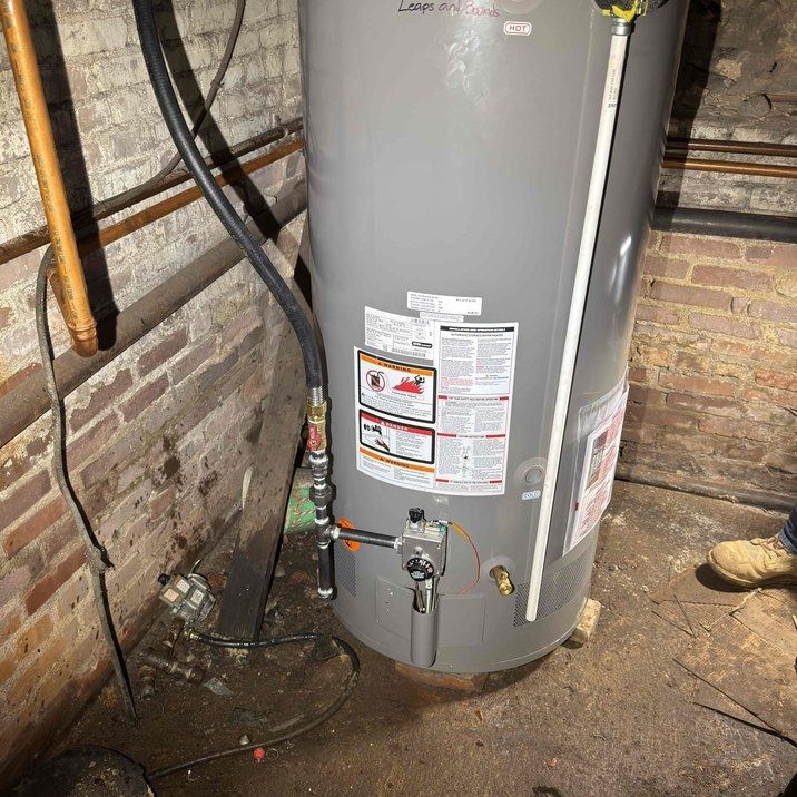 New water heater installed by Leaps and Bounds with piping and venting